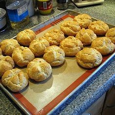 freshly baked muffins on a baking sheet ready to be cooked in the oven