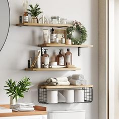 a bathroom with two shelves above the toilet and various items on the wall behind it