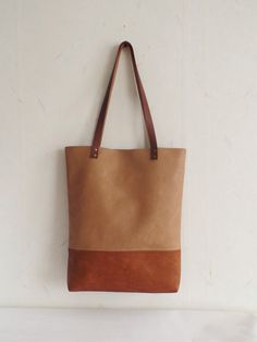 Large vegan leather tote - color block vegan leather tote bag in cognac brown and caramel/toffee brown. * Exterior: - Bottom - high quality vegan leather in cognac brown color -Top - high quality very durable vegan leather in sandy\caramel\toffee brown color * Interior: - Available with natural cotton polka dot lining in sandy beige and white or natural linen geometric print pattern in light beige. Please choose the lining you prefer from Variations. * Two inside slip pockets * Real leather hand Everyday Brown Tote Shoulder Bag, Brown Satchel With Leather Handles For Everyday, Everyday Brown Tote Satchel, Brown Tote Bag With Leather Handles, Brown Leather Handle Tote Bag, Beige Leather-backed Tote Bag, Dark Tan Tote Satchel, Camel Tote Bag For Errands, Brown Satchel With Leather Handles For Errands