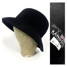 80s black wool hat by Kangol, design called Modeleine. So British and timeless.  Can be worn up and down. Soft shape. Quite deep (circa 11cm) Brim with few rows of stitching. No Kangol logo externally. Nice condition. SIZE: Regular M Brim: 7cm Internally: 55cm Retro Wide Brim Cloche Hat For Winter, Vintage Winter Brimmed Cloche Hat, Vintage Brimmed Cloche Hat For Winter, Winter Vintage Brimmed Cloche Hat, Vintage Black Bucket Hat, Classic Black Wool Cloche Hat, Vintage Wool Top Hat With Wide Brim, Vintage Wool Cloche Hat With Short Brim, Retro Black Brimmed Bucket Hat