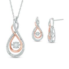 From the Unstoppable Love™ Collection, this gorgeous diamond pendant and earrings set celebrates your ever-evolving romance. Crafted in sleek sterling silver and precious 10K rose gold, the pendant's outer infinity symbol-shaped design highlights a ribbon of shimmering diamonds overlaid by a curving polished ribbon of rose gold. At its center, a single diamond glistens in a unique setting that moves with every beat of her heart and every turn of her head. The pendant suspends along an 18.0-inch Rose Gold Diamond Jewelry Sets For Anniversary, Rose Gold Infinity Jewelry With Diamond Accents, Diamond Pendant And Earrings, Zales Jewelry, Modern Gold Jewelry, Diamond Pendant Sets, Infinity Pendant, Infinity Jewelry, Fine Diamond Jewelry