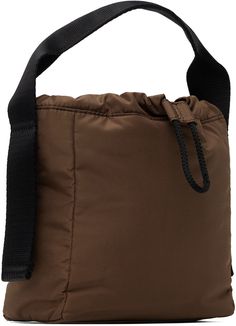 Recycled polyester taffeta top handle bag in brown. · Logo bonded at rolled webbing carry handle · Drawstring closure · Fully lined · H7 x W7.5 x D3.5 Supplier color: Chocolate fondant Brown Nylon Bag With Adjustable Strap, Brown Nylon Bag With Removable Pouch, Brown Nylon Shoulder Bag With Detachable Strap, Brown Nylon Bags For Outdoor Use, Brown Nylon Bags For Outdoor, Outdoor Brown Nylon Bags, Taffeta Top, Tech Bag, Brown Logo