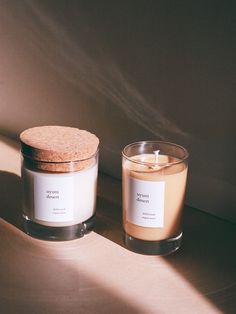 two candles sitting next to each other on a table