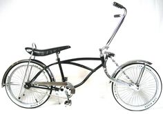 a black and white photo of a bike on a white background with the seat up