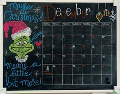 a chalkboard calendar with the grin face drawn on it