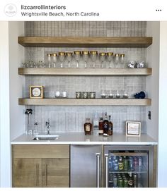 a kitchen with shelves filled with bottles and glasses