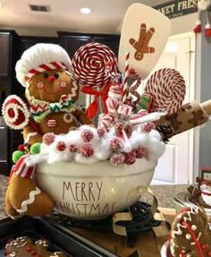 a bowl filled with lots of candy and candies on top of a kitchen counter