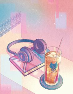 a drink and headphones on a table