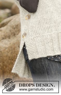 a close up of a person wearing a sweater with buttons on it