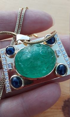 Absolutely Stunning Victorian 14k Yellow Gold, Carved Emerald, Diamond Baguette and Round, Blue Sapphire Cabochon Pendant with a Chain.. Chain is 14k, made in Italy ( stamped), added later . Weight is 28 Grams. Measurements are approximately  42mm x 26mm..pendant.  Perfect Pre Owned Condition. all sales are final no return. Some pics ENLARGED to see details. Absolutely Stunning Necklace, look Spectacular. ATTENTION BUYERS ALL ITEMS FROM MY SHOP MUST BE PURCHASED STRAIGHT FROM ETSY.COM Website NOT FROM OFFSITE ADDS Google and Others  All orders purchasing from Google and others will be cancelled . Carved Emerald, Sapphire Cabochon, Diamond Baguette, Pendant With Chain, Cabochon Pendant, Wedding Jewellery Necklace, Halo Engagement Rings, Stunning Necklace, Baguette Diamond