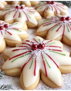 cookies decorated with white and red icing on a table