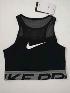 Nike Stretch Crop Top For Workout, Black Breathable Tops With Medium Support, Black Fitted Top For Sports Events, Fitted Black Tops For Sports Events, Nike Functional Black Tops, Functional Black Nike Tops, Nike Go-dry Tops For Sports, Nike Black Functional Tops, Nike Stretch Sports Crop Top