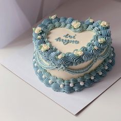 a heart shaped cake on top of a piece of paper