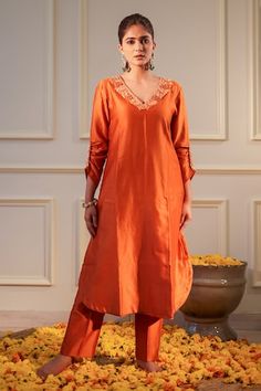 Burnt orange A-line kurta featuring floral hand embroidery around the neckline with gathered sleeve and side pocket. Paired with a straight pant. - Aza Fashions Orange Embroidered Palazzo Set With Straight Kurta, Embroidered Orange Palazzo Set, Navratri Orange Chikankari Palazzo Set, Orange Sets With Resham Embroidery For Spring, Orange Resham Embroidery Sets For Spring, Spring Orange Sets With Resham Embroidery, Spring Orange Resham Embroidery Sets, Orange Floral Embroidered Sets, Spring Festive Orange Kurta