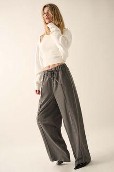 Solid twill pants. Drawstring elastic waist. Hip pockets. Wide leg. Pintuck detail. Full length. Loose fit. 70% Tencel, 25% Rayon, 5% Spandex. Imported. Designed in LA. Model wears size S. Fall Tapered Leg Pull-on Sweatpants, Stretch Straight Leg Pants With Drawstring, Fall Ankle-length Sweatpants With Elastic Cuffs, Fall Straight Leg Sweatpants With Drawstring, Relaxed Fit Fall Pants With Elastic Side Panels, Fall Season Straight Leg Sweatpants With Drawstring, Relaxed Fit Pants With Elastic Side Panels For Fall, Fall Pants With Elastic Side Panels And Relaxed Fit, Fall Straight Pants With Drawstring