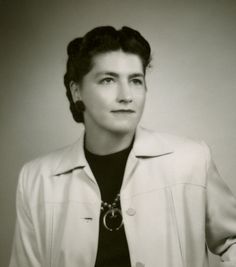 black and white photograph of a woman wearing a jacket