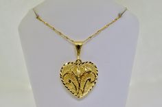 Type of Gold: Yellow Gold Metal Purity: 14k Weight of Gold: 6.2 Grams Pendant Length including Bale: 1.5 inches Pendant Width: 1.0 inches Chain Length: 22 inches   We are a small family owned business located in Massapequa, N.Y. Customer satisfaction is our number one goal, and we will do everything we can to ensure that you are very happy with your purchase! In most cases we are a reseller, not the original owner of the item being auctioned or sold. We do our best to assure all items are in goo Yellow Gold Heart Pendant Necklace Keepsake, Heart-shaped 14k Yellow Gold Locket Necklace, Yellow Gold Tarnish-resistant Heart Pendant Necklace, Yellow Gold Round Pendant Heart Necklace, Tarnish Resistant, Yellow Gold Heart-shaped Necklace With Hallmark, Gold Heart Pendant, Types Of Gold, Heart Pendant Gold, Bracelets Gold Diamond