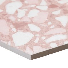 a pink and white table top with small hearts on the surface, against a white background