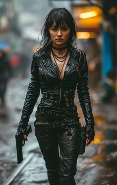 a woman in black leather outfit walking down the street