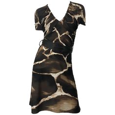 Chic and rare vintage mid / late 80s ROBERTO CAVALLI for NEIMAN MARCUS giraffe print belted short sleeve jersey dress! Features timeless giraffe animal print in chocolate brown and ivory. Flattering ruched tailored bodice and sleeves. Hidden zipper up the side. Detachable brown silk belt. Can easily be dressed up or down. Great with wedges, flats or sandals for day, and heels or boots for evening. In great condition. Made in Italy Marked Size IT 42 ( US 6 / 8 ) Measurements: (lots of stretch) 34 90s Jersey, Grey Silk Dress, Roberto Dress, Informal Dress, Classy Fits, Jersey Vintage, Printed Gowns, Black Dress With Sleeves, Late 80s