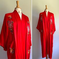 This stunning kimono features an intense shade of cherry red with traditional floral embroidery in hues of pink, green, yellow and blue. Unlined. Fits up to large sizes.  Label: none  Era: early 2000s  Pictured on a US size 6/8 dress form  Two hip pockets  Clean and ready to wear  Minor scuff on lapel (see photo) Red Spring Robe For Loungewear, Red Robe With Kimono Sleeves For Spring, Long Floral Embroidery Kimono For Festivals, Long Floral Embroidered Kimono For Festival, Red Vintage Kimono For Spring, Red Bohemian Robe With Kimono Sleeves, Red Long Sleeve Spring Robe, Vintage Red Long Kimono, Vintage Long Red Kimono