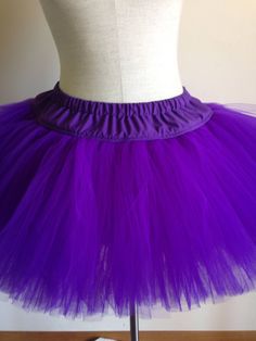 "This adult size tutu features your choice of tulle in colors of red, purple, blue, green, yellow,white black or orange sewn onto a fabric waistband. Tulle is aprox 11 inches in length. Waistband is 3 inches in length. Elastic fits waists size 27\" - 39\". Also available in plus sizes. Check out the TuTu section of my shop for my complete line of adult sized TuTus, headband tutus and pet tutus." Summer Purple Tulle Tutu Dress, Spring Purple Tutu Dress With Tulle Skirt, Purple Tulle Tutu Dress For Spring, Purple Tutu Dress For Costume Party In Summer, Purple Tutu Dress For Summer Costume Party, Stretch Tulle Tutu Dress For Costume Party, Fitted Purple Tutu Dress For Spring, Fitted Lavender Tulle Tutu Dress, Spring Costume Tulle Tutu Dress