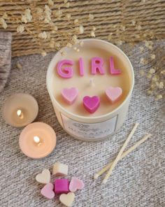 The perfect candle to celebrate a new baby girl.   The candle is presented in a neutral glass jar topped with cute pink wax letters and hearts.  The candle will last upto 60 hours in a fabulous scent of your choice.  Once lit, the candle will reveal a beautiful display of colors and shimmer that the recipient will love. A truly unqiue gift they will be sure to remember.  Each candle is highly fragranced and made by us in our Manchester studio using the highest quality ingredients. The candle is packed by hand in our signature gift box filled with shredded paper, completely free of plastic.   Each candle comes as standard with a set of our beatiful candle matches. The box is filled with approximately 15-20 matches which are 8cm long.   For more candles like this, please see our shop.  A bit Wax Melts Recipes, Baby Reveal Cakes, Beeswax Candles Diy, Candle Workshop, Dog Candle, Baby Shower Candles, Candle Matches, Candle Cake