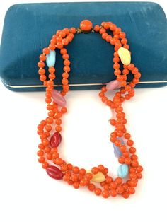 Vintage Colorful Glass Beaded Necklace, Art Deco Orange Glass Multi Color Rainbow Necklace, Bright bold colorful beaded necklaceAmazing vintage new old stock Art Deco 1930s Czech glass beaded orange necklace with multi color twist beads. The necklace is in good antique condition, they are new old stock and were found in their original form so some might be a bit dusty but they are in overall good antique condition. The orange is bright and beautiful and a very unique shade from what I have seen. Vintage Glass Beaded Necklaces With Colorful Beads, Vintage Orange Necklace With Colorful Beads, Vintage Orange Beaded Chain Necklace, Orange Oval Beads For Jewelry Making, Vintage Orange Beaded Necklace, Orange Beaded Costume Jewelry Necklaces, Orange Costume Jewelry Beaded Necklace, Vintage Orange Round Beads Necklace, Vintage Orange Round Bead Necklace