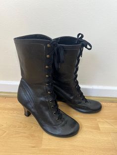 A pair of vintage Schuh black lace up Victorian style leather boots. The inside has some flaking and cracks to the lining. UK Size 5 EU Size 38 Heel height - 3 inches Vintage Boots With Laces For Fall, Vintage Leather Sole Combat Boots For Fall, Vintage Black Heeled Boots For Winter, Vintage Combat Boots With Leather Sole For Fall, Vintage Fall Boots With Laces, Vintage High Heel Lace-up Boots For Fall, Vintage Lace-up Boots For Fall, Winter Vintage High Heel Lace-up Boots, Vintage Lace-up Leather Boots