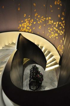 a spiral staircase with flowers in the center