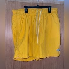 New Without Tags Casual Yellow Swim Trunks With Built-in Shorts, Yellow Drawstring Shorts For Summer, Yellow Casual Short Swim Trunks, Casual Yellow Shorts For Poolside, Casual Yellow Short Swim Trunks, Casual Yellow Bermuda Shorts, Yellow Casual Short-length Swim Trunks, Yellow Short Swim Trunks For Spring, Casual Yellow Bottoms For Poolside