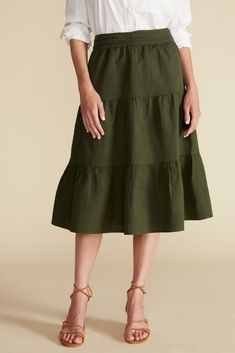 A flirty tiered silhouette and rich neutral hue make this skirt perfect for dressier evenings or effortless everyday style. Midi-length, tiered, a-line skirt with gathered waist, smocking at the back, and side zip closure 55% Organic Cotton, 55% Linen Ethically Made in India Linen Skirt, Everyday Style, A Line Skirt, Feminine Style, Cotton Linen, A Line Skirts, Midi Length, Side Zip, Everyday Fashion