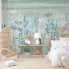 a bedroom with a wall mural and wicker chair in front of the bed,