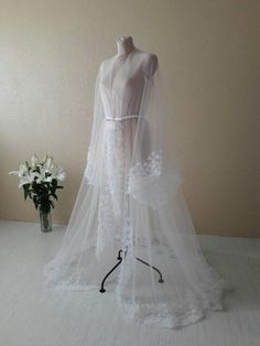 Check out this item in my Etsy shop https://www.etsy.com/listing/724418166/couture-dress-white-boudoir-dress-desing Ethereal White Floor-length Gown, Sheer Tulle Wedding Dress For Bride, White Gown With Long Train For Wedding Night, White Wedding Gown With Long Train, White Tulle Gown With Long Train, Ethereal Tulle Wedding Gown, Ethereal Organza Wedding Gown, Wedding Night Gown With Detachable Tulle Train, Tulle Gown With Detachable Train For Wedding Night