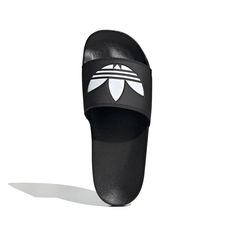 Style No. FU8298 Color: Core Black / Cloud White / Core Black Full-time vacation vibes. These Adilette Lite Slides free your feet. (Or wear them with socks, no judgment here.) This pair features a super-soft footbed for an instantly comfy feel. There's an adidas Trefoil on top so you can feel sporty, even when you're lounging. Slip-on Synthetic bandage upper Super-soft feel Cushioned sporty slides Synthetic outsole Sport Slippers, Black Slides, Adidas Adilette, Adidas Trefoil, Clean Shoes, Helly Hansen, Slides Shoes, Black & White, Mens Vans