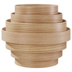 four wooden bowls stacked on top of each other in the shape of a spiral design