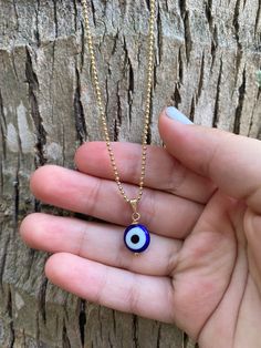 "This necklace is combination of -Handmade Blue Evil Glass bead. -18\" Gold Filled Chain . 🧿The evil eye is a curse or legend believed to be cast by a malevolent glare, usually given to a person when they are unaware. ... Talismans or amulets created to protect against the evil eye are also frequently called \"evil eyes\".🧿" Blue Beaded Chain Spiritual Necklace, Blue Spiritual Beaded Chain Necklace, Blue Beaded Chain Necklace With Spiritual Style, Blue Beaded Charm Necklaces With Round Beads, Blue Tiny Beads Necklace For Gifts, Blue Necklaces With Tiny Beads For Gifts, Blue Tiny Beads Necklace For Gift, Blue Necklaces With Tiny Beads As Gift, Gold Beaded Necklaces With Evil Eye For Gifts