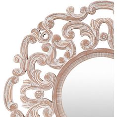 an ornate mirror is shown against a white background and has swirly designs on it