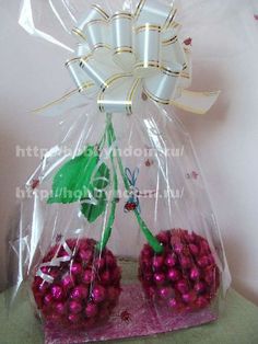 two plastic bags filled with pink and white balls