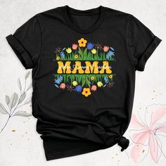 "Mama Floral Shirt, Personalized Mom Shirt With Kids Names, Mothers Day Shirt, Mom Birthday Tee, Wild Flower Mommy Shirt, Custom Gift for Mom Hello, Thanks for your support. Your gladness comes first and all work is done with Love in here. Always keep your support, please:) Floral Mama with Kid Names Shirts are branded Bella+Canvas.  Floral Mama with Kid Names Shirt  Contents: - Solid colors: %100 Cotton.  - Heather colors: %52 Cotton + %48 Polyester* This ultra-soft graphic tee is made from a comfortable cotton-poly blend that is breathable, non-shrinking, and lasts longer than your average graphic shirt. HOW TO ORDER YOUR FLORAL MAMA WITH KID NAMES SHIRT  -Please, Check and Review all  Floral Mama with Kid Names Shirt Photos. -Select Your Floral Mama with Kid Names Shirt T-Shirt Size and Spring Birthday Short Sleeve Top, Spring Short Sleeve Birthday Top, Short Sleeve Tops For Spring Birthday, Multicolor Tops For Spring As A Gift, Graphic Print Tops For Birthday And Mother's Day, Spring Shirt With Letter Print For Gifts, Spring Letter Print Shirt For Gift, Spring Letter Print Shirt As Gift, Spring Birthday Crew Neck Top