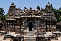 an elaborately carved building with steps leading up to it