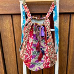 Unique, Vintage Handcrafted Drawstring Satchel Backpack Bags From India. Recycled Saris Are Hand Stitched In Traditional Kantha Quilting. One Of A Kind Vibrant Patterns Braided Tasseled Drawstring Closure + Interior Pocket H: 12” In. W: 18” In. Bag Length W/ Strap: 24” In Gusset :10” In Boho Ethnic Shoulder Market Free People Anthropologie Urban Outfitters Festival Beach Travel Floral Hippie Gypsy Yoga Paisley Roomy Tote Crossbody Purse Carryall Handbag Carry Shopping Rucksack Kantha Rag Rug Purses, Monkey Bags, Kantha Quilting, Monkey Bag, Jansport Backpacks Big Student, Kantha Sari, Boho Backpack, Fawn Design, Satchel Backpack