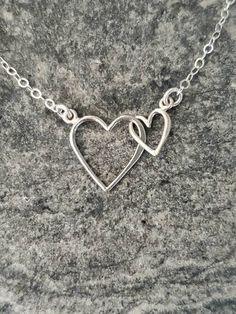 "Beautiful Sterling Silver double heart pendant. Perfect for mother/ daughter necklace or makes a great Mother's Day or Valentine's Day gift. The shiny Sterling Silver hearts are attached together but move loosely and independent of each other. Each heart is attached to a sterling silver chain and has a sterling silver spring clasp in back. Shown here in 17\". *If you are unsure of the length you need, or would like to wear this item at different lengths, we now offer an adjustable length option Mother's Day Double Heart Necklace With Heart Beads, Handmade Double Heart Necklaces For Anniversary, Nickel Free Double Heart Jewelry For Anniversary, Nickel-free Double Heart Necklace For Anniversary, Heart Necklace With Heart Charm For Mother's Day, Mother's Day Jewelry With Double Heart Charm, Mother's Day Heart Necklace With Heart Pendant And Beads, Handmade Double Heart Necklaces For Mother's Day, Double Heart Charm Necklace For Mom