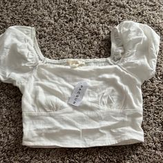 White Shirt It’s So Cute I Love It It Just Doesn’t Fit Me. Brand New With Tags On Green Halter Top, Quarter Zip Hoodie, Pacsun Tops, Blue Floral Blouse, Spaghetti Strap Top, Sweater Tank Top, Heart Shirt, Bustier Top, Tie Dye T Shirts