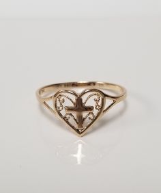 "Thanks for shopping our vintage estate store. We tend to sell well below wholesale and truly hope you enjoy all of our items. Many of the items are one of a kind, so please enjoy scrolling through the pictures and hopefully something will catch your eye. Blacks spots are from the reflections. Estate14k yellow gold cross heart filigree ring. Ring size: 6.75 Setting: 3/8\" Band width: 1.5mm Weight: .97 gram Stunning ring, marked 14k. As with most estate items there may be some wear on item. We do Purity Ring Christian, Coquette Ring, Cross Wedding Ring, Angel Rings, Silver Weddings, Cross Rings, Victorian Style Jewelry, Cross Heart