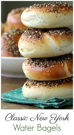 bagels stacked on top of each other with sesame seed sprinkles in the middle