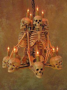 a skeleton chandelier with candles in it