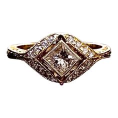 a gold and white diamond ring with diamonds on it's shants, set against a white background