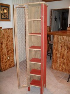 an open storage cabinet in the middle of a room