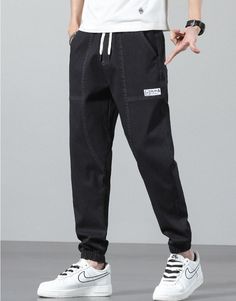 Vinny Denim Joggers are a pair of men's relaxed fit jogging pants that can pair with a streetwear or workout outfit. Featuring a relaxed fit, these joggers offer maximum comfort for men who want to feel comfortable all day long. Available in the following variants: Black, Blue, Grey Material: Cotton & Denim Style: Casual / Smart Casual Season: all seasons Gender: MEN Feature: Breathable/Comfortable, Stretched Size chart in CM Size chart in INCH Casual Jeans With Elastic Waistband For Streetwear, Streetwear Straight Leg Cargo Jeans With Elastic Waistband, Streetwear Cargo Jeans With Elastic Waistband, Straight Leg Cargo Jeans With Elastic Waistband For Streetwear, Denim Pants With Elastic Waistband For Streetwear, Sporty Denim Pants With Relaxed Fit, Sporty Relaxed Fit Denim Pants, Sporty Denim Jeans For Streetwear, Sporty Straight Leg Denim Pants